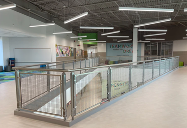 Modern steel railing design for balcony inside a school building.