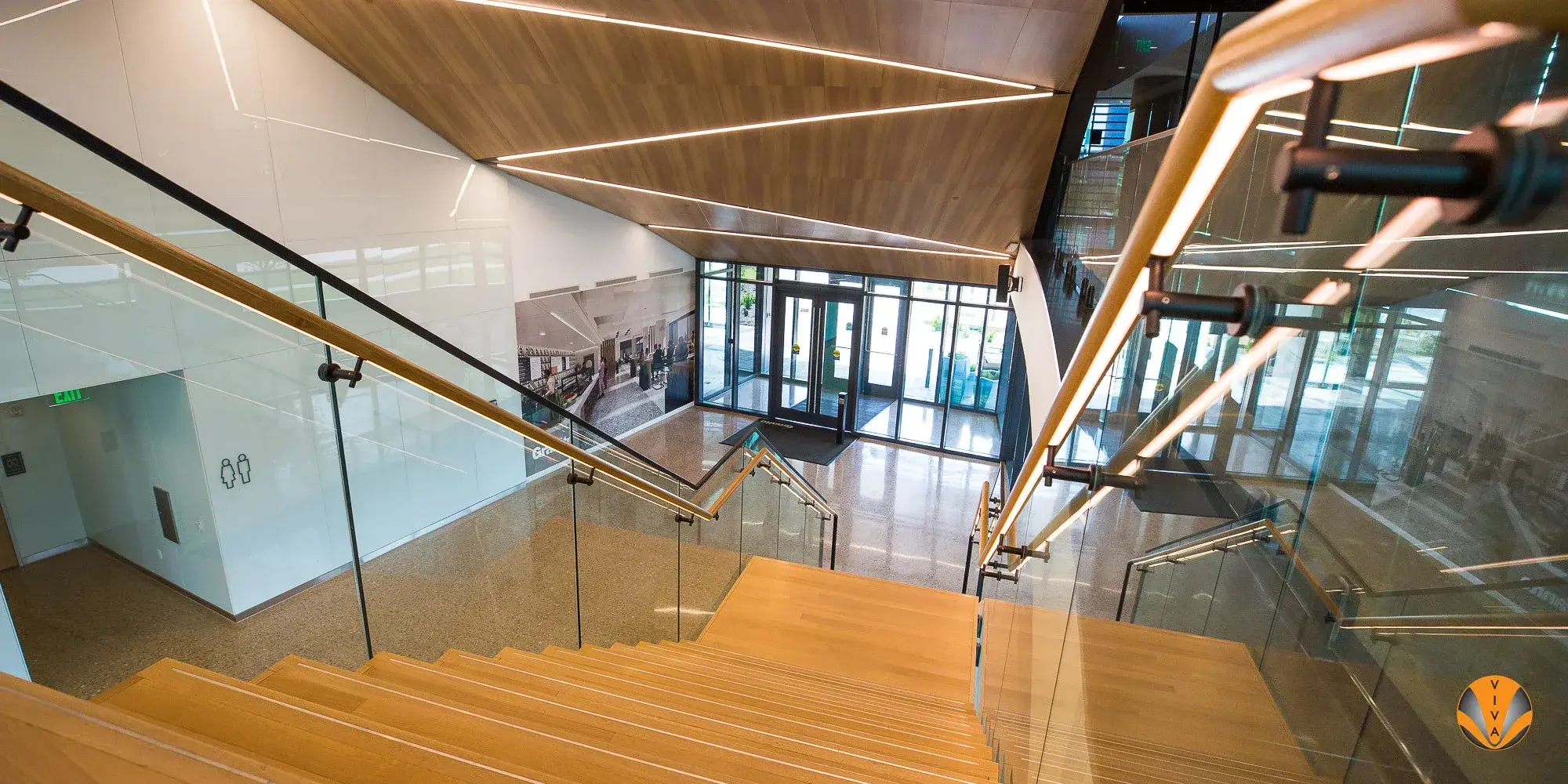 LED-illuminated metal handrail along a modern commercial walkway at Granite Park VI.