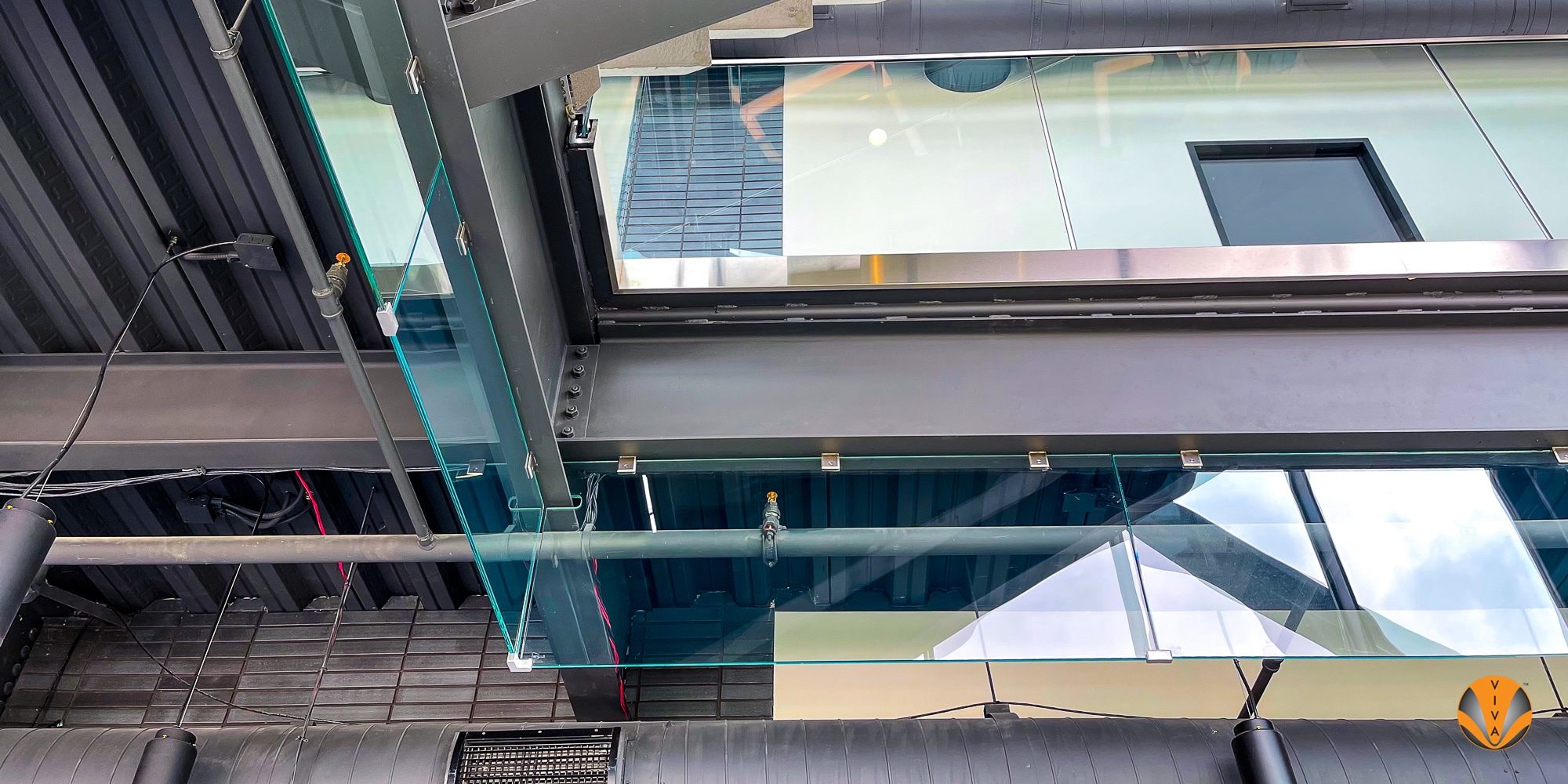 Smoking Railing Smoke Barrier System & VIEW™ Button Glass - Core… | VIVA Railings