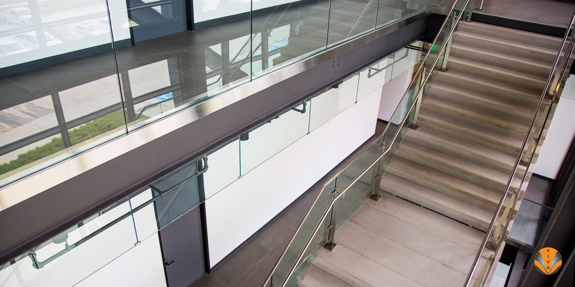 Smoking Railing Smoke Barrier System & VIEW™ Button Glass - Core… | VIVA Railings